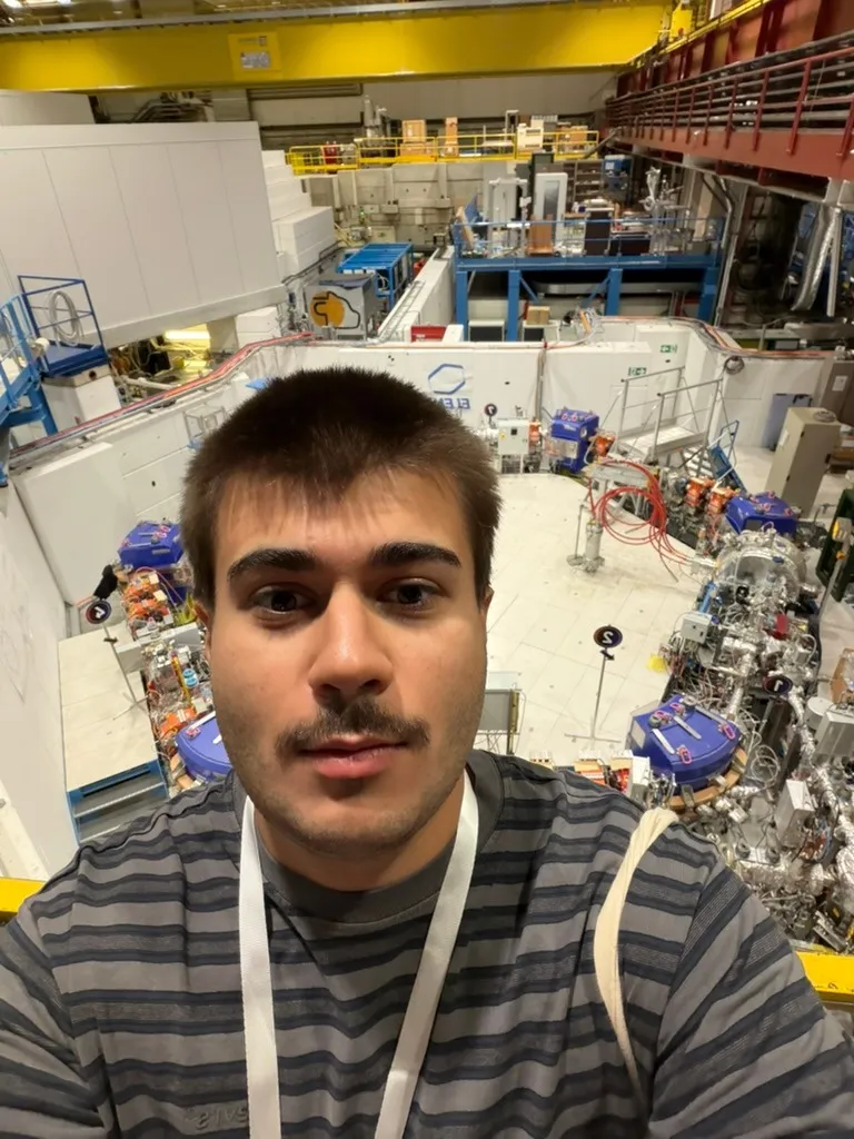 Maryan visiting CERN’s Antimatter Factory, with the experimental equipment behind him